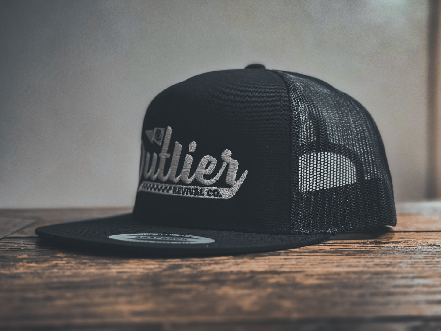 "Outliers" Trucker Hat